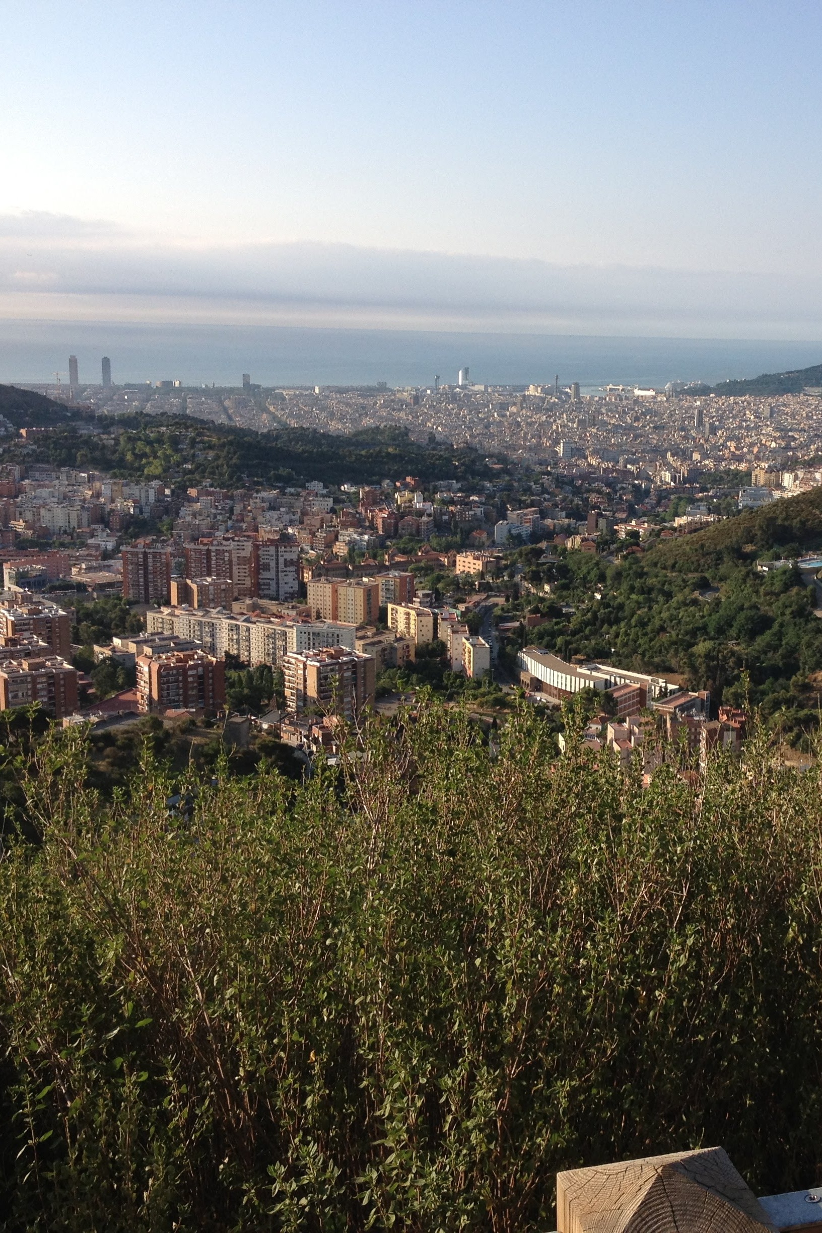 A view over Barcelona from the Collserola hills above the city, taken on the Ronda Verde de Barcelona, a circular cycle route. Photo © Dugald Steer 2013.