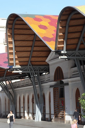 A photo of the entrance to Santa Caterina market in Barcelona, showing the artistic curved roof. Photo courtesy of Rick Lighthelm on Flickr for www.travelmag.com. 