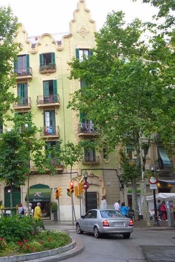 A picture of a fine building on the Rambla del Poblenou, a popular avenue in Barcelona.